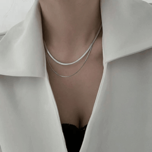 Serpent necklace packaging with red cloth