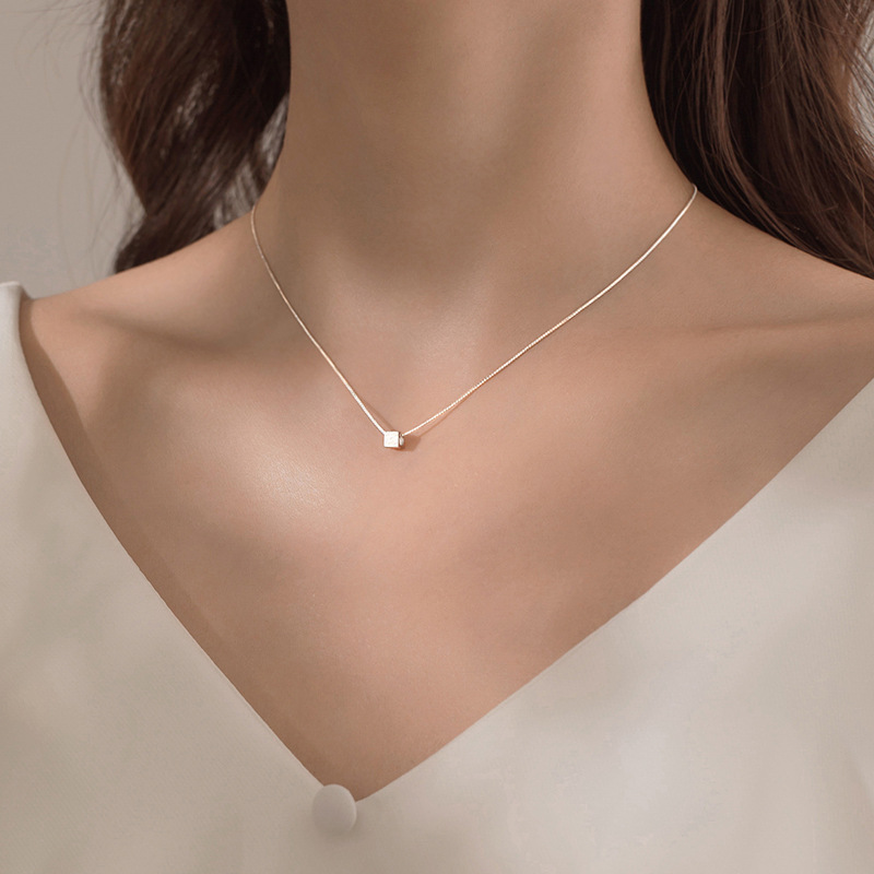 Business woman wearing Feng Shui necklace for success