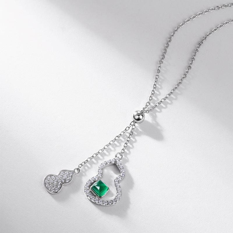 Alt Text Title Caption Description Feng Shui Emerald Necklace Professional Styling CEO Wearing Necklace in Boardroom "Amplify negotiation energy with Wood/Metal elements" Features 925 silver chain contrasting against navy power suit Emerald Gemstone Close-Up AAA Cultured Emerald under Microscope "Precision-cut 4x4mm stone for optimal Qi activation" Macro view showing VS1 clarity and laser inscription Adjustable Cross Chain Detail 925 Silver Chain Length Demo "Customizable 40-45cm fit for all body types" Model demonstrating extension clasp functionality Gift Packaging Unboxing