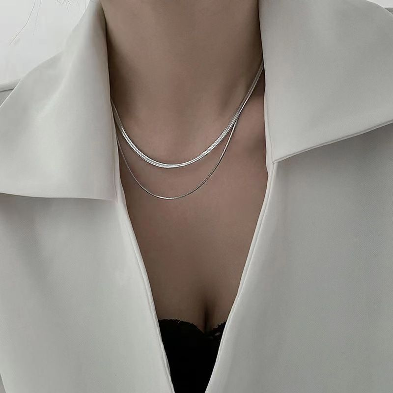 Serpent necklace packaging with red cloth