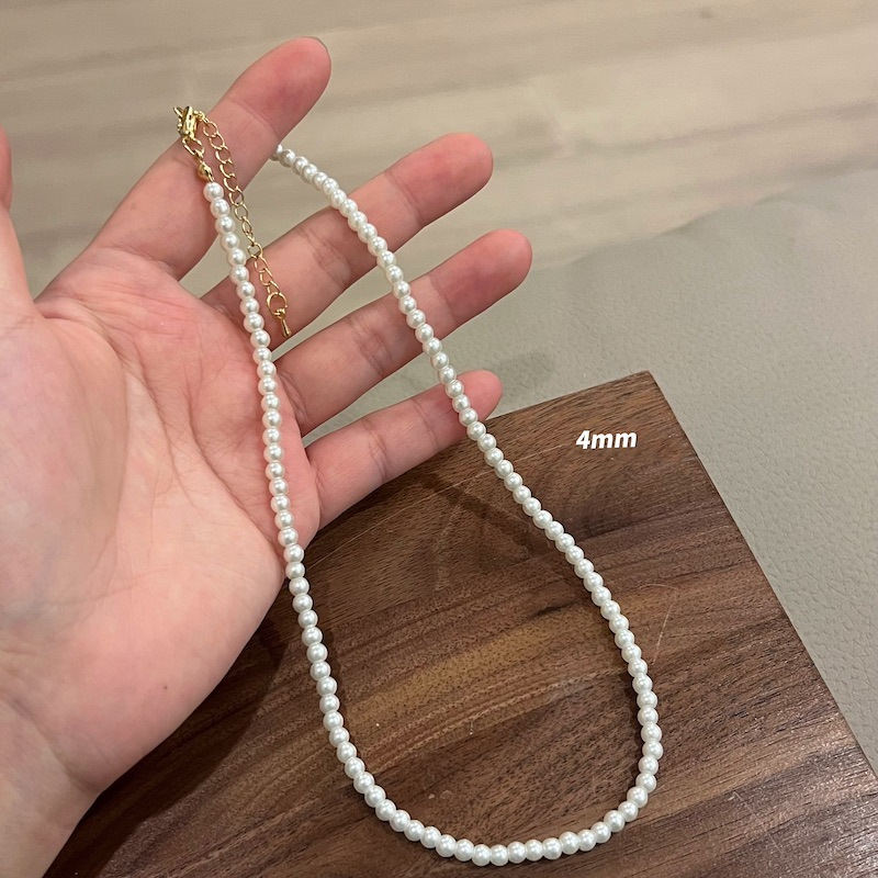 "How to Layer Pearl Necklaces"